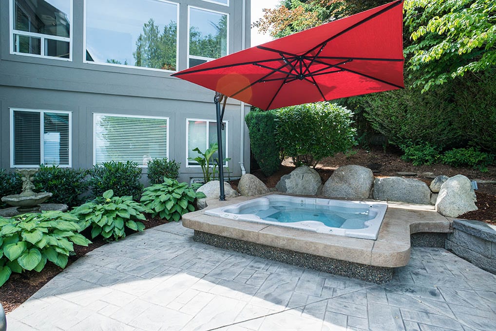 hot tub with custom concrete surround