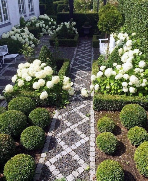 Side yard with grave lpatterned pathway