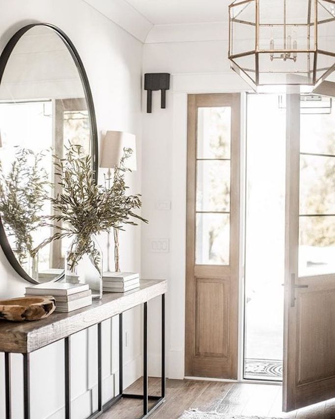 entryway iwth oversized round mirror and console