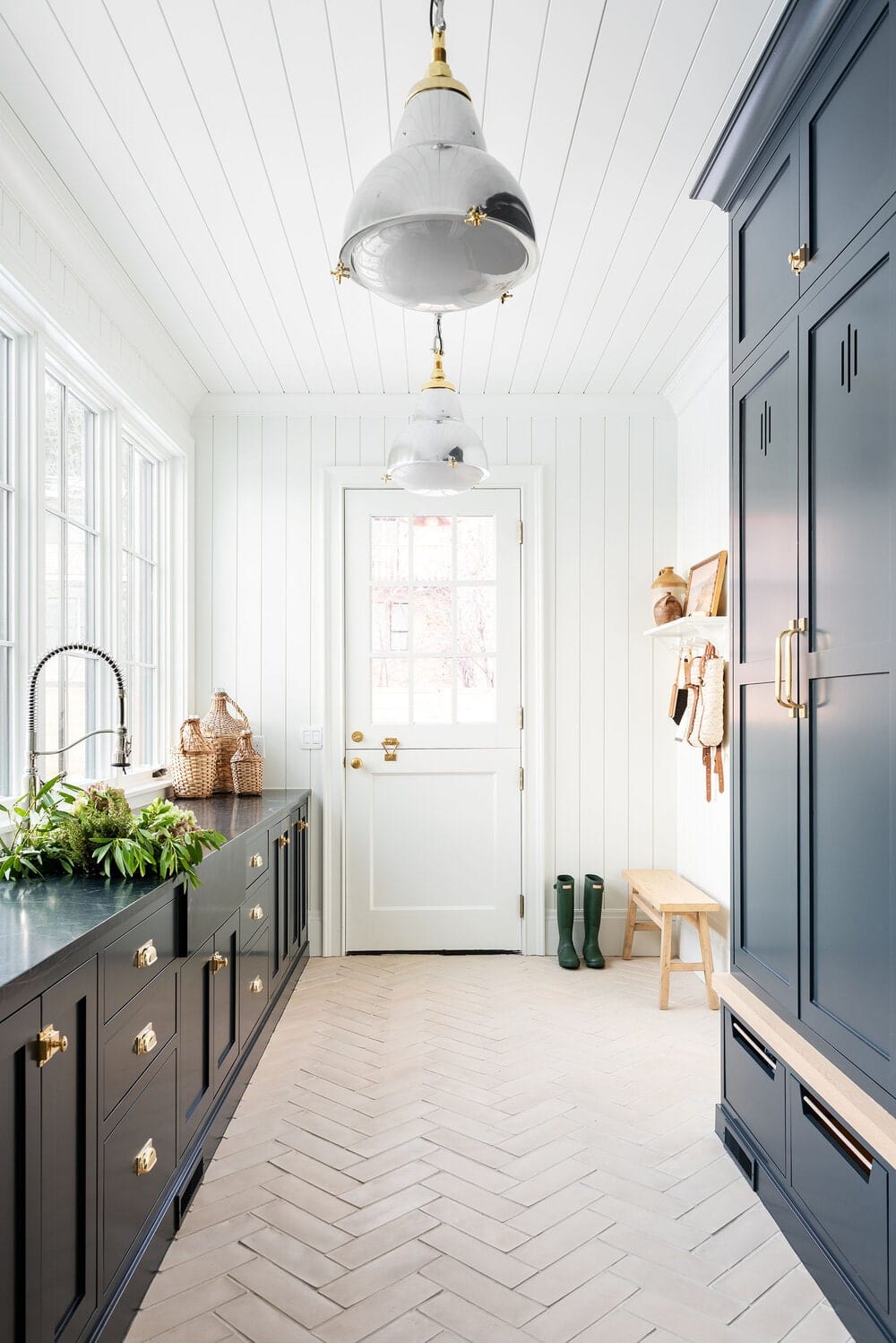 narrow mudroom with sink 