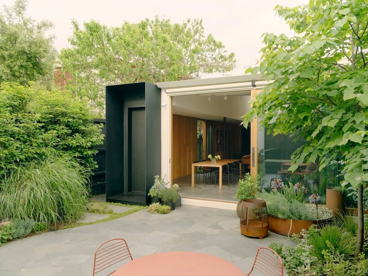 laneway house view from yard with sliding door open