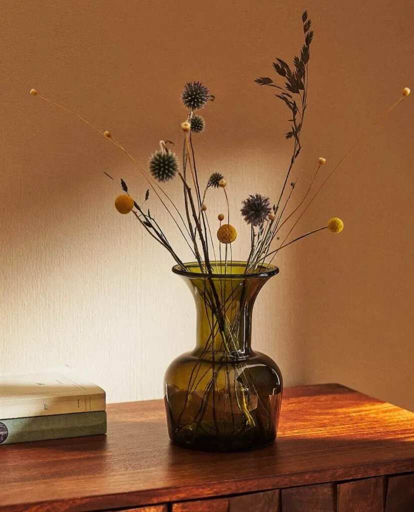 dried fall flowers in glass vase