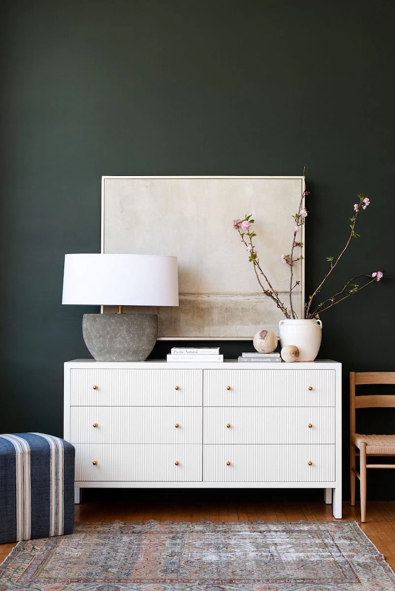 where to hang art above furniture