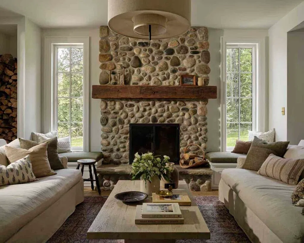 river stone fireplace with wood mantel