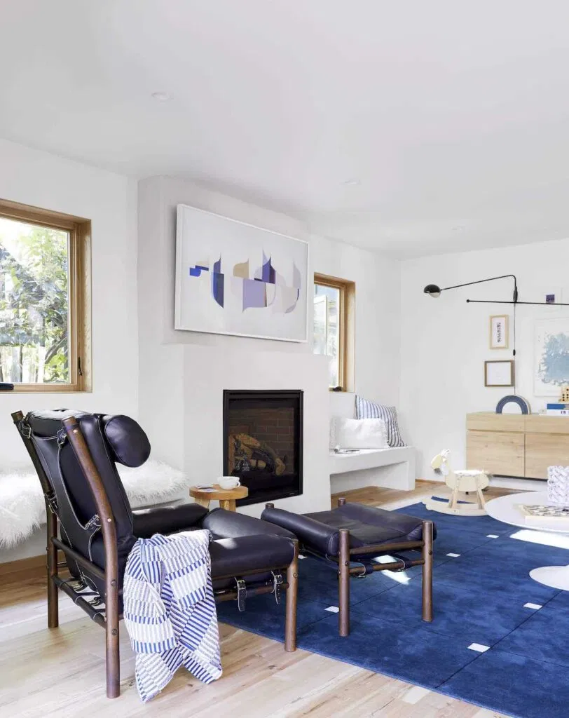 Scandinavian minimalist fireplace with TV above