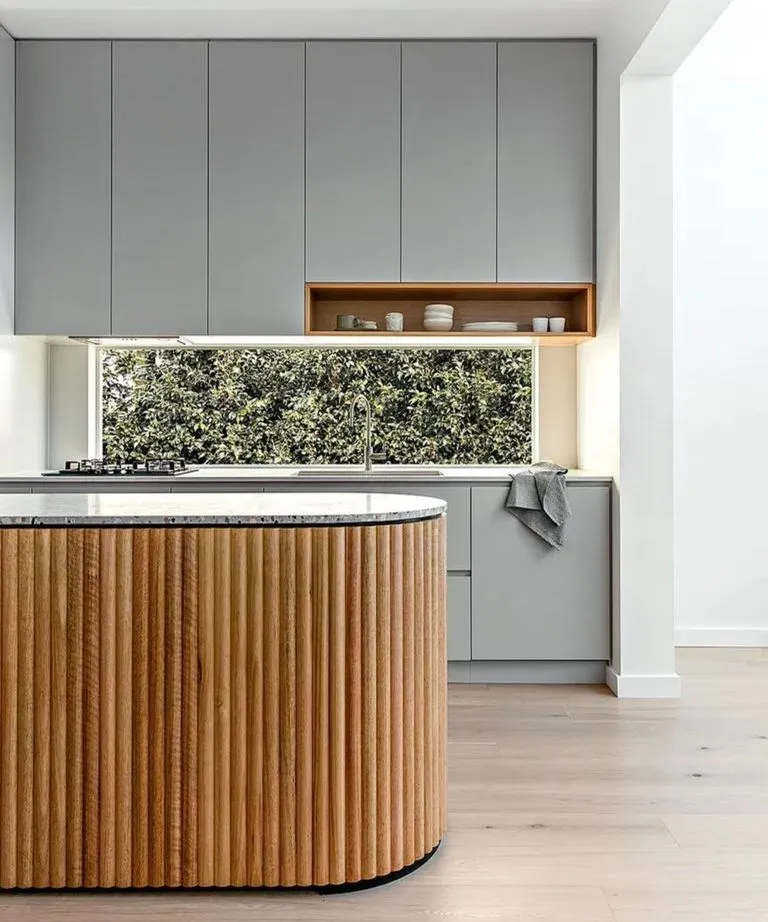 fluted wood kitchen island and minimalist cabinetry